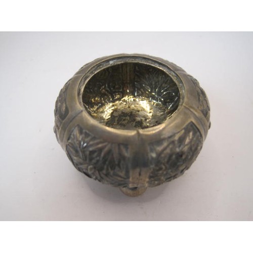 21 - Chinese white metal small bowl on three ball feet, repousse and engraved decoration of figures and f... 
