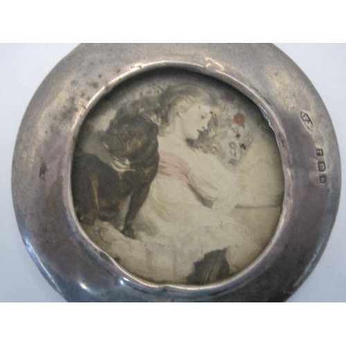 23 - Small circular silver photograph frame, overall diameter 6cm, visible aperture 3.7cm, wooden back an... 