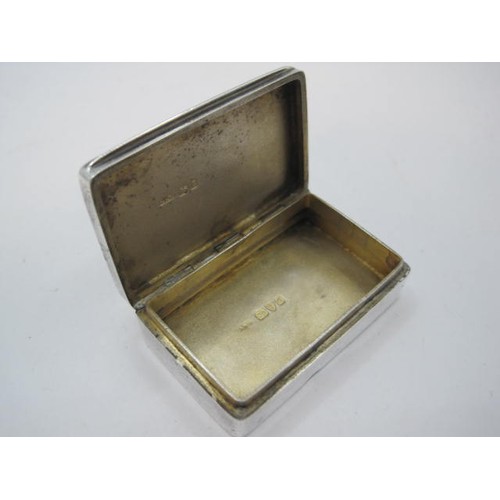 86 - A plain silver snuff box with hinged lid, gilt interior, match strike to back edge, 5cm x 3.2cm x 1.... 