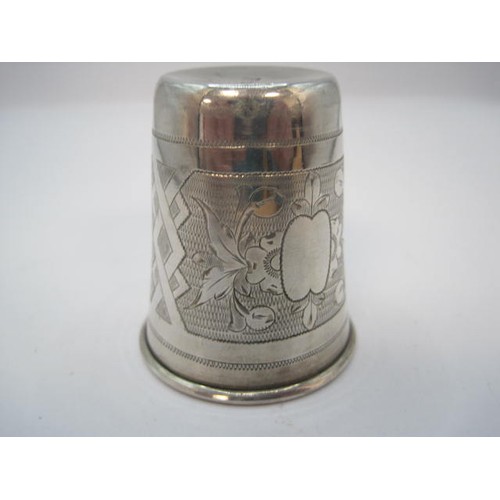 90 - Russian silver stirrup cup, the exterior with engine turned and foliate engraved panels, one vacant ... 