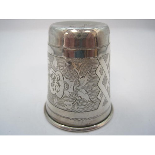 90 - Russian silver stirrup cup, the exterior with engine turned and foliate engraved panels, one vacant ... 