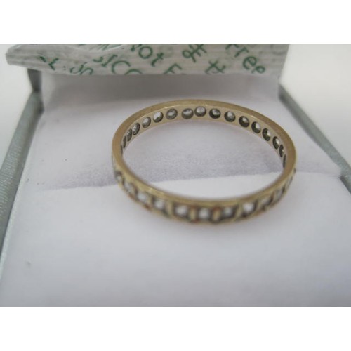 98 - 9 carat gold eternity style ring set with small white stones (a/f, one missing, untested), size N/O,... 