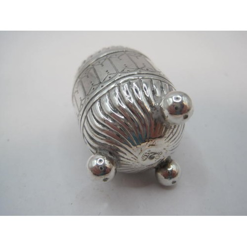 101 - A silver-plated pepper of distinctive cylindrical shape with wrythen domed top and finial, the sides... 