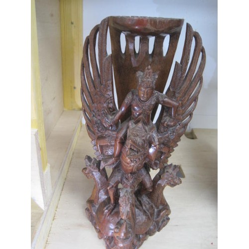 146 - An imposing Far Eastern (probably Indonesian) carved and stained wood group of Garuda and Vishnu sta... 