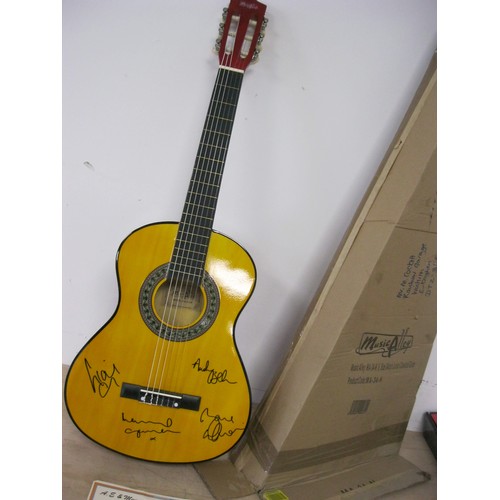 194 - An acoustic guitar signed by all 4 members of the group Oasis, boxed, with certificate of authentici... 