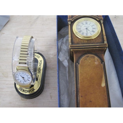 115 - A Sekonda Ladies watch in original box  plus a resin mini grandfather clock with mini quartz movemen... 