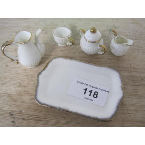 118 - A mini dolls house teaset on a mini tray in fine bone china