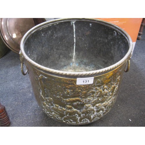 131 - Large brass coal bucket with raised decoration showing hunting scene.