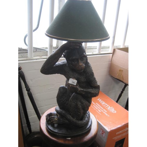 143 - A ceramic base monkey table lamp in a brown glaze colourway