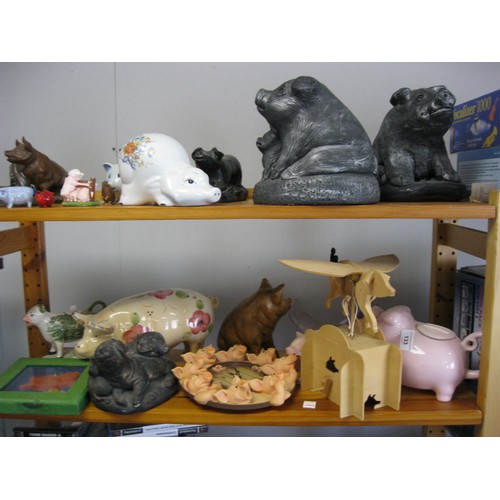 133 - A selection of pig ornaments and a clock  from resin to ceramics in a variety of sizes