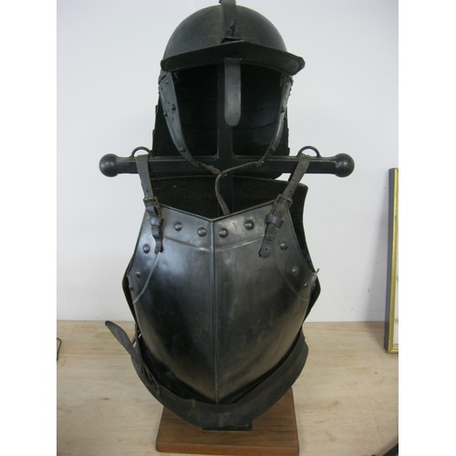 230 - A reproduction Roundhead Helmet and Infantry Cuirass mounted on a wooden stand, the pair in good ord... 