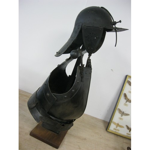 230 - A reproduction Roundhead Helmet and Infantry Cuirass mounted on a wooden stand, the pair in good ord... 