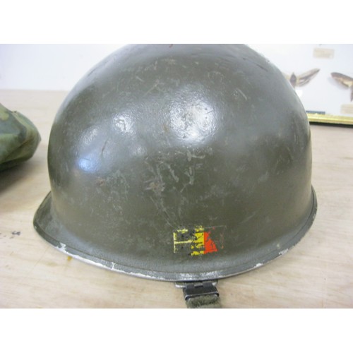 227 - A post-WW2 US M1 Helmet with liner, chinstrap and camouflage cover, in good order