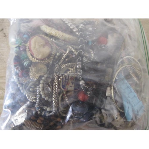 284 - A large bag of Costume Jewellery