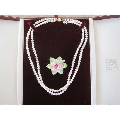 112 - A cased pearl necklace with a 9ct clasp and a boxed Royal Doulton rose