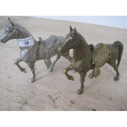 38 - Middle eastern style brass model of a saddled horse and a matching model in a grey alloy, height 19c... 