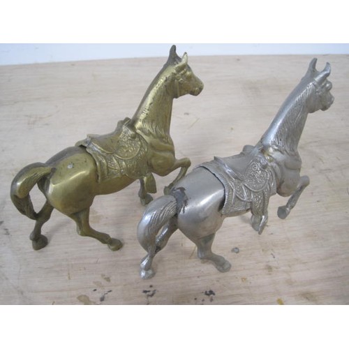 38 - Middle eastern style brass model of a saddled horse and a matching model in a grey alloy, height 19c... 