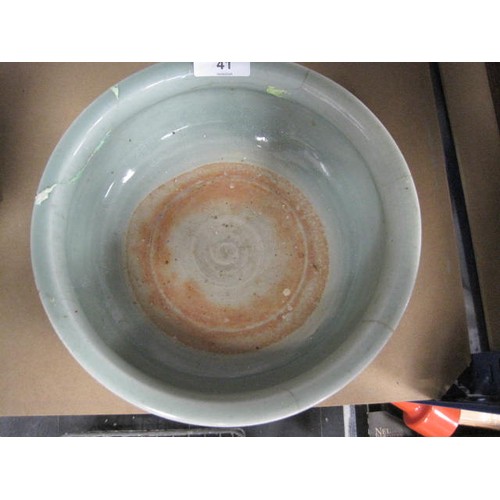 41 - Celadon glaze Chinese pottery footed bowl with incised hash pattern decoration to the outside. (A/F,... 