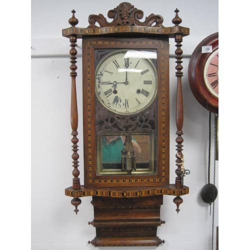 51 - A regulator type wall clock in a decorative case with inlay, fretwork and turned pilasters. A/f - a ... 