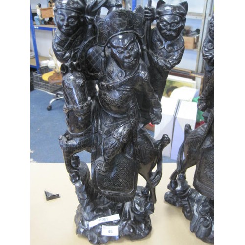 45 - An imposing pair of Chinese or Far Eastern carved wood groups each with warrior on horseback and two... 