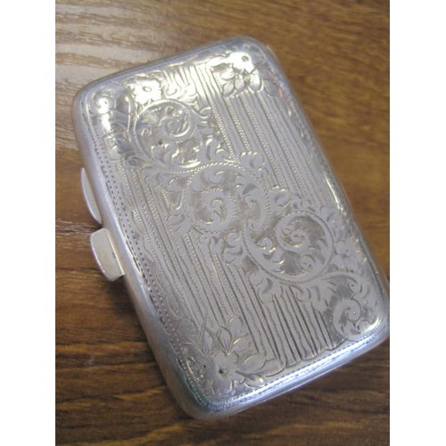 11 - A sterling silver cigarette case, floral decor to top and base, vacant cartouche, latch and hinge go... 