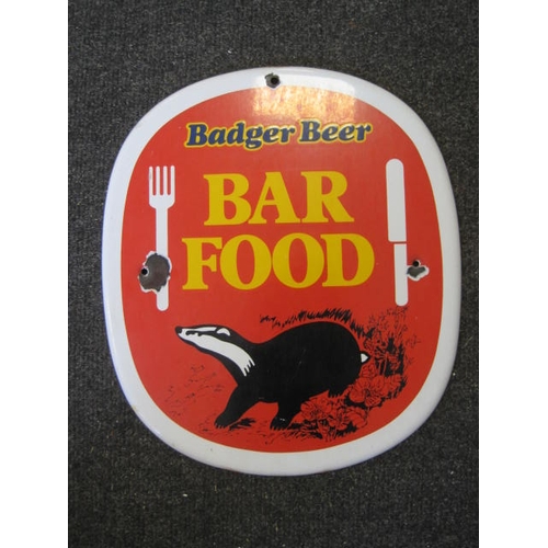 230 - A vintage enamel sign for Badger Beers food offer