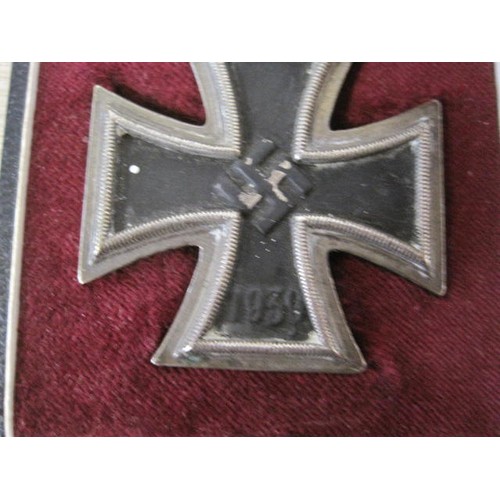 239 - A WW2 Knight's Cross with oak leaves and swords, with ribbon, in a fitted box which is designed for ... 