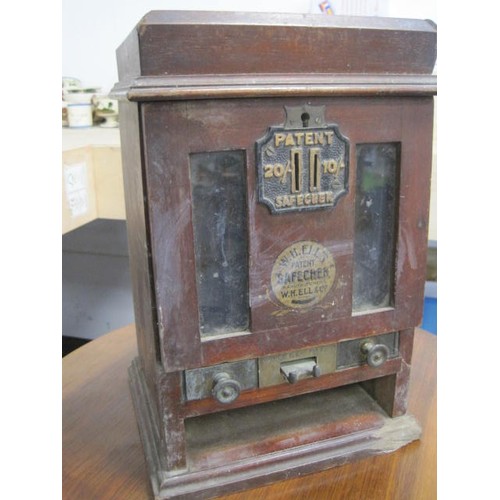 241 - A vintage vending machine with a selection of internal brass trays, marked 'Safechek' by W H Ells & ... 