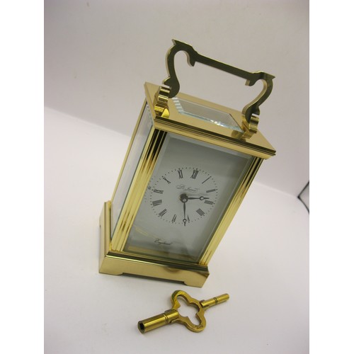 27 - A St James of London heavy brass carriage clock in original box and packaging, 8 day movement, never... 