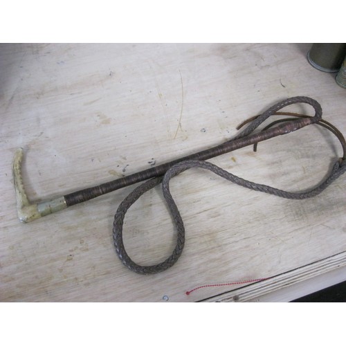 46 - A Swaine & Adeney riding / hunting whip With a stag horn handle and leather plaited whip. With medal... 