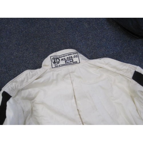 51 - Motor Racing Interest - A white FIA approved motor racing coverall branded for Goodwood and Dunlop, ... 