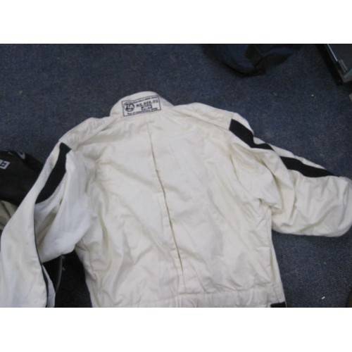 51 - Motor Racing Interest - A white FIA approved motor racing coverall branded for Goodwood and Dunlop, ... 