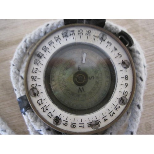 209 - A military compass with War Department arrow, marked TG Co Ltd MkIII and dated 1944, in good order w... 