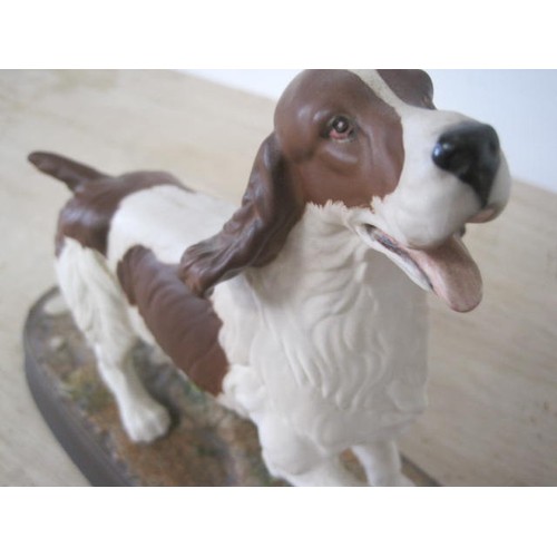 129 - Royal Doulton Beswick figure 'The Spaniel', height 21cm, length of oval base 29.5cm.