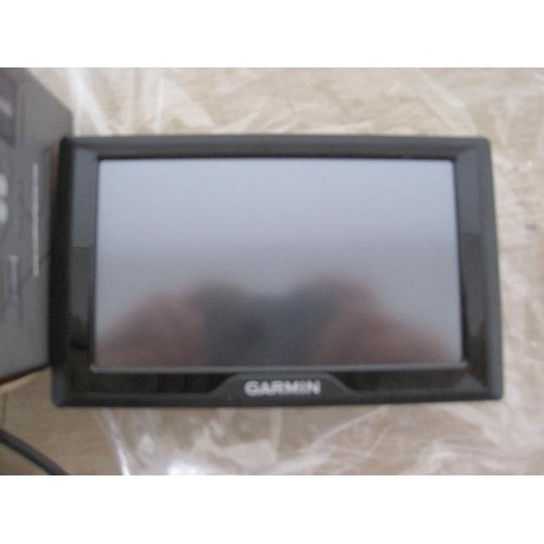 128 - Garmin 145-01615-11 satnav with power adaptors, and Road Angel Gem plus with boxed accessory pack. N... 