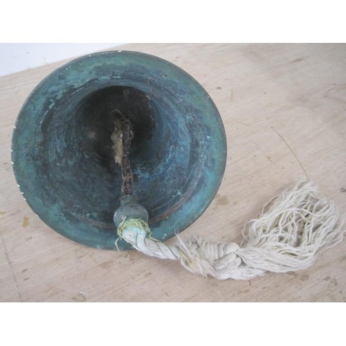 115 - A ship's bell, height 21cm, roped clapper. No markings, probably mid to late 20th century, patinatio... 