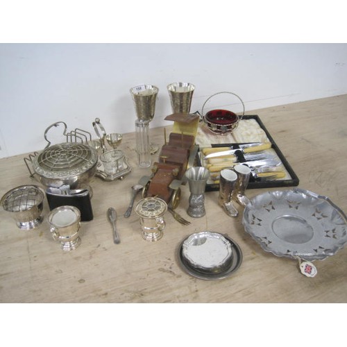 158 - Assorted electroplated and metal ware, including goblets, boiled egg stand, flower arrangers, a smal... 