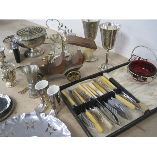 158 - Assorted electroplated and metal ware, including goblets, boiled egg stand, flower arrangers, a smal... 