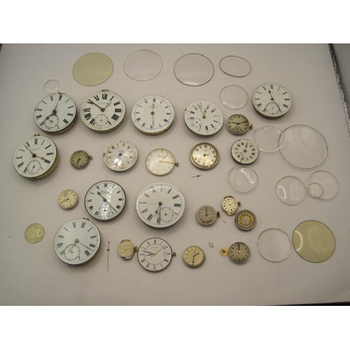 243 - Bag of watch movements and crystals (wrist and pocket). Not tested.