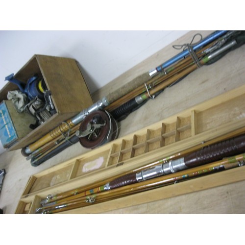 124 - Sea fishing rods and tackle - a mixed lot including two Orient cane rod handles and seven extensions... 