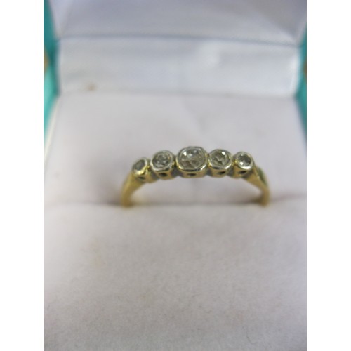 255 - An 18 carat gold ring set with 5 diamonds in a platinum mount, the largest of roughly 0.1 ct, ring s... 