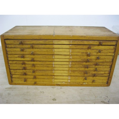 139 - A vintage wooden coin collector's cabinet of 14 trays, each to hold 21 coins giving storage for a to... 