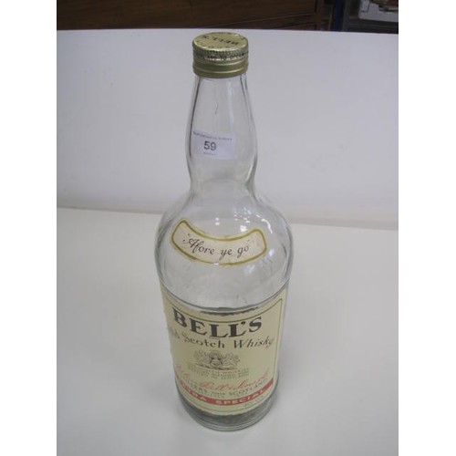 59 - 4.5 litre bottle of Bell's Old Scotch Whisky, empty of whisky, but the bottle is filled to a level o... 