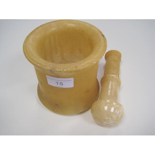 15 - Alabaster or similar stone mortar and pestle (a/f). Height of mortar 12cm, length of pestle 16.5cm. ... 