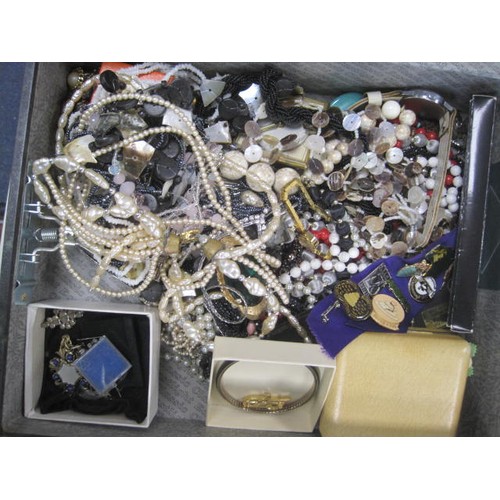 24 - Assorted costume jewellery (the contents of one box file) including badges relating to cake decorati... 