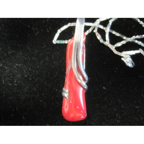 37 - A 925 silver pendant (4.5cm) set with red glass to resemble coral specimen in a curved surrounding m... 