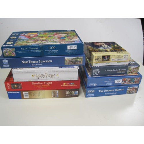 30 - Nine boxed jigsaw puzzles (not checked) including Gibbons 1000 piece, Harry Potter, Feline Frenzy et... 