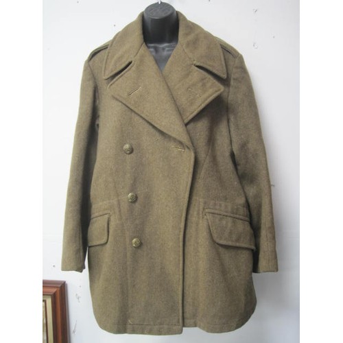 4 - A WW2 vintage New Zealand issue battledress blouse and a New Zealand issue greatcoat, the latter cut... 