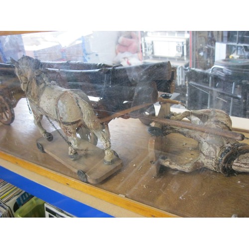 323 - An interesting model horse and cart display - two horses mounted on wheeled wooden stands (height ab... 