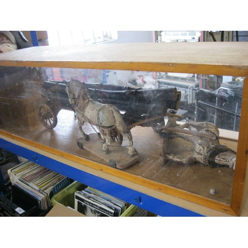 323 - An interesting model horse and cart display - two horses mounted on wheeled wooden stands (height ab... 